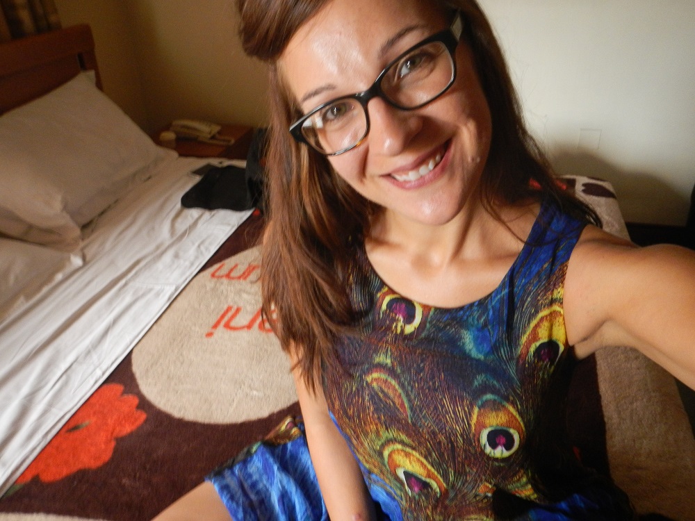 Me in my new peacock dress in my hotel room. Yay!